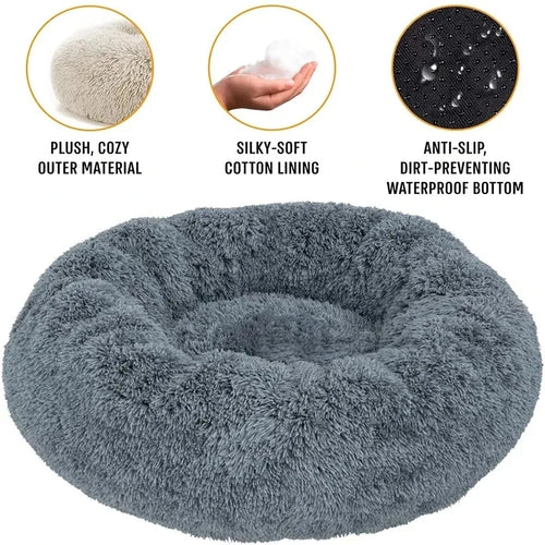 Gray donut pet bed with features highlighted on a white background